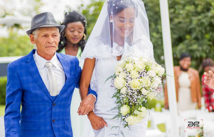 Zimbabwean Bride walks down the aisle at Golden Conifer Functions Venue - Zimbabwe Wedding Venues - Zimbabwe Weddings