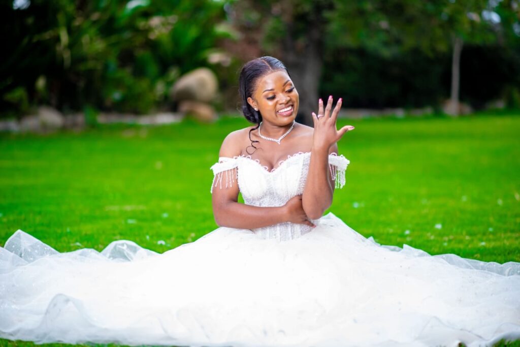 Bride wearing white wedding dress from Minnie Bridal Boutique at a wedding in Harare - Zimbabwe Wedding Dress for hire - Zimbabwe wedding planner - Featured Vendor Fridays - Wedding Expos Africa 