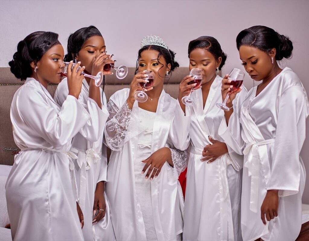 Bride and Bridesmaids drinking champagne, wearing silver morning robes and from Minnie Bridal Boutique at a wedding in Harare - Zimbabwe Wedding Dress for sale - Zimbabwe wedding planner - Featured Vendor Fridays - Wedding Expos Africa 