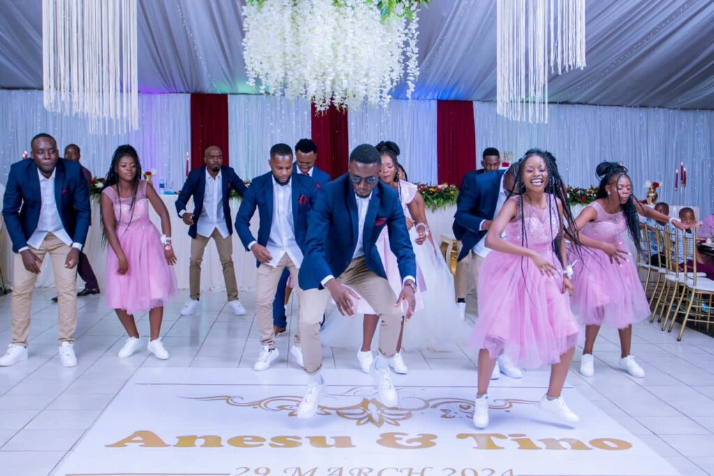 Coach Nygee Choreography performing dance choreography with bridal team at a Zimbabwe wedding | Zimbabwe wedding choreography choreographers | Zimbabwe wedding dance masteps | Featured Vendor Fridays 