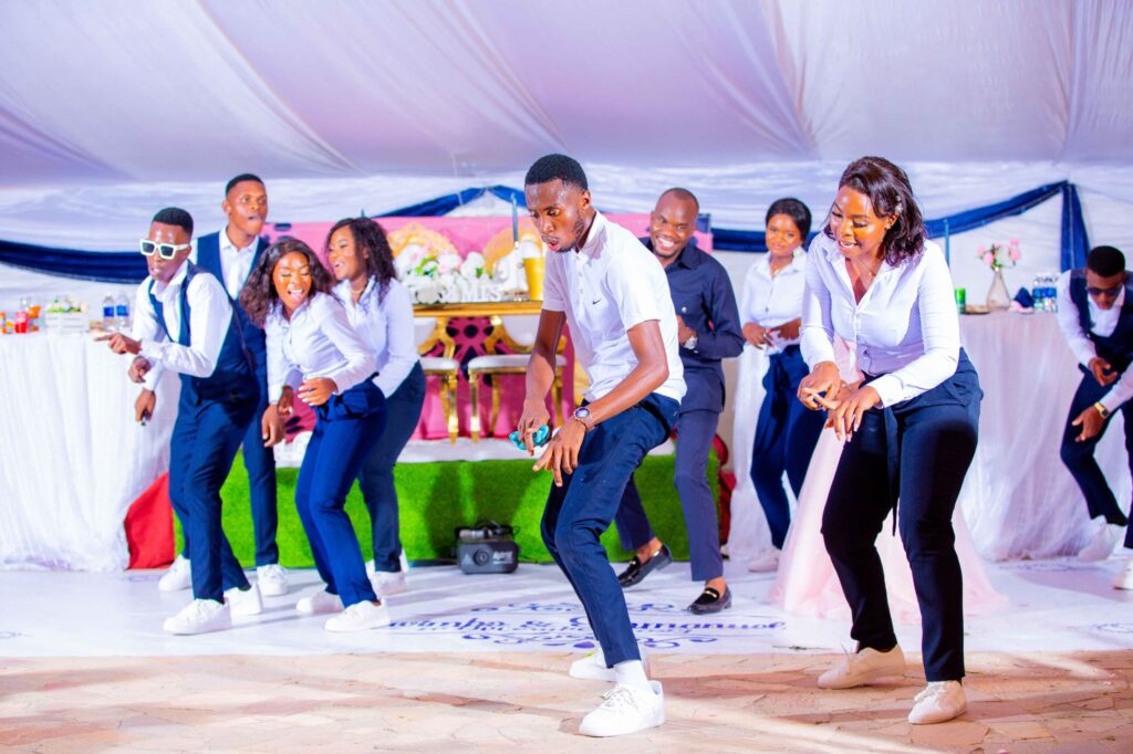 Coach Nygee Choreography performing dance choreography with bridal team at a Zimbabwe wedding | Zimbabwe wedding choreography choreographers | Zimbabwe wedding dance masteps | Featured Vendor Fridays | Zimbabwe wedding planner blog 